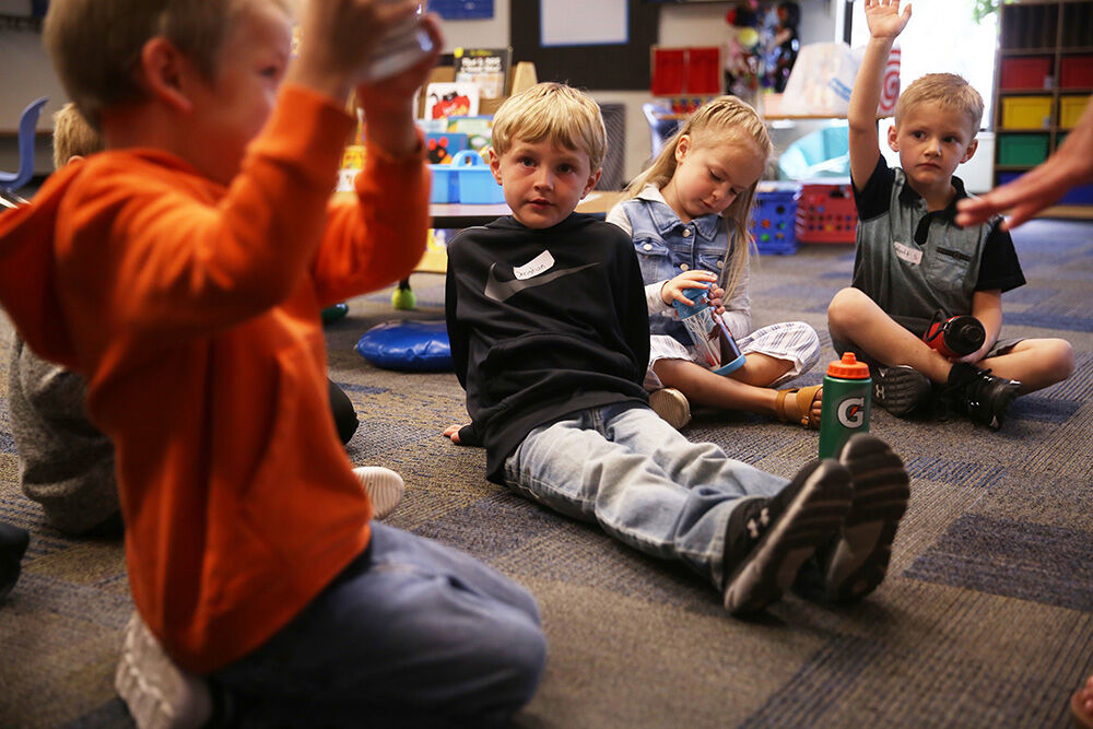 Christian Nelson listens as one of his classmates answers a question